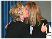 Hillary kissing Arafat's wife.